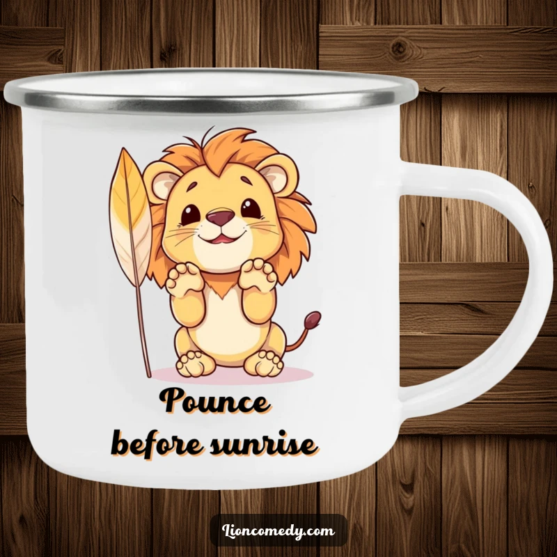 Funny camping mug showing a small lion cub leaping towards a feather, paws outstretched in a playful pounce.