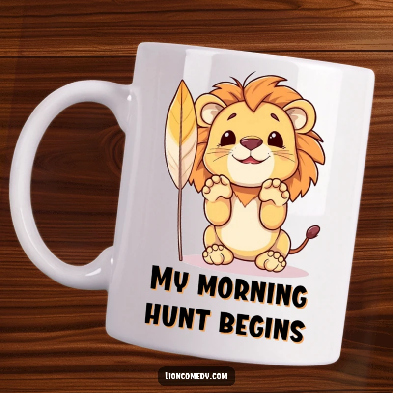 Funny mug featuring a cute little lion cub with paws raised high, playfully anticipating a pounce on a dangling feather.