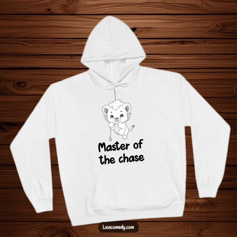 Funny kawaii lion cub hoodie showcasing a delightful cub playfully pouncing on a dangling string, radiating pure, unadulterated joy and fun.