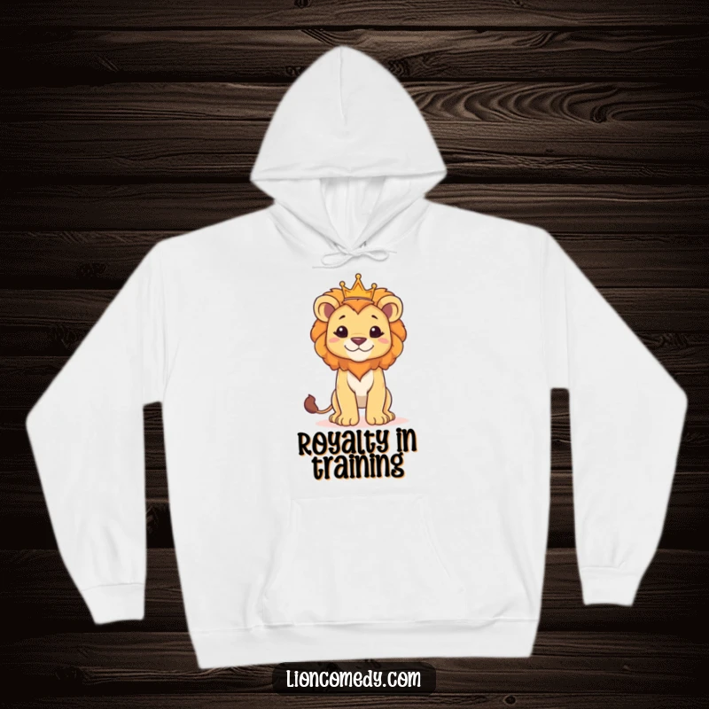 Funny hoodie showcasing a proud lion cub standing tall and wearing a small crown, offering cozy regality.