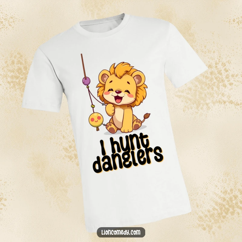 Funny lion cub t-shirt depicting a cub actively and playfully batting at a dangling string toy with focused determination.