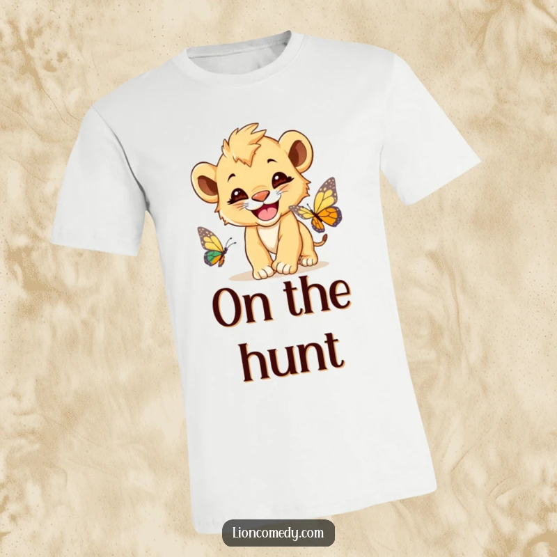 Funny Lion Cub T-Shirt, a cute lion cub with a huge grin, enthusiastically chasing a delicate butterfly.