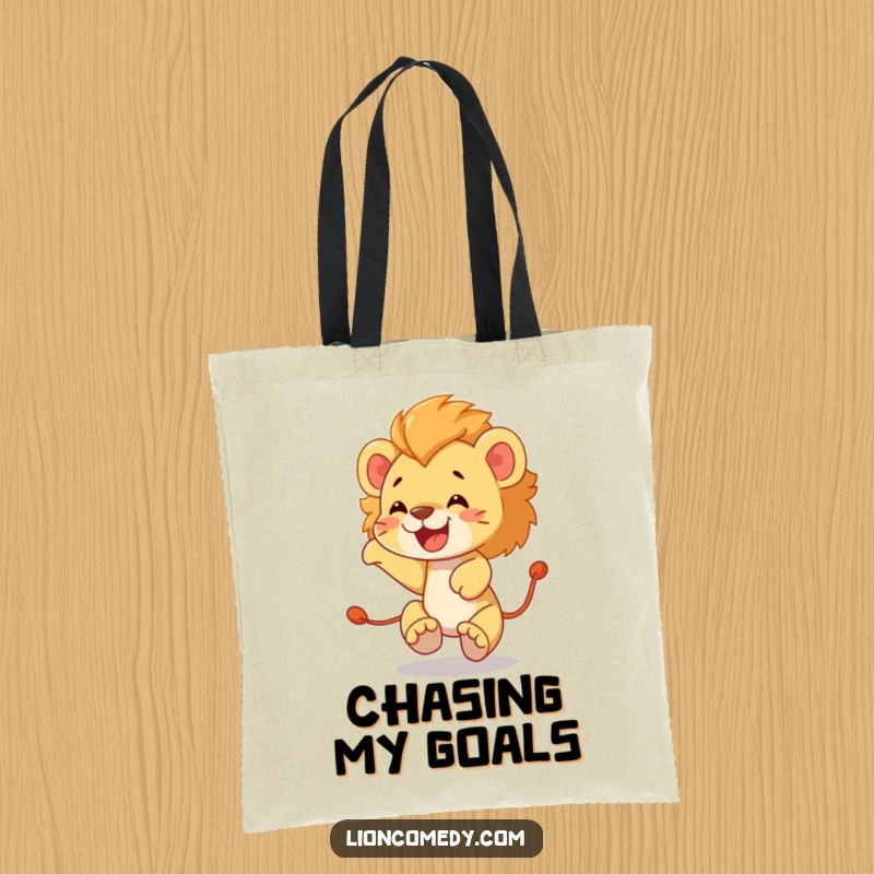 Funny lion cub tote bag depicting a happy, energetic cub joyfully chasing its own tail in a circular motion.