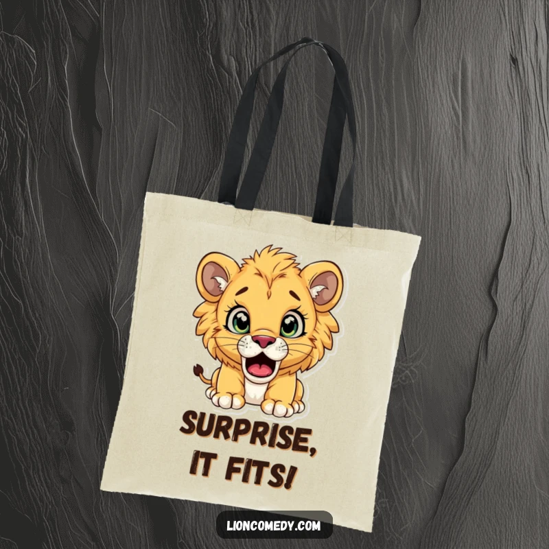 Funny lion cub tote bag depicting a cub with enormous, staring eyes and an open mouth, conveying sheer surprise.